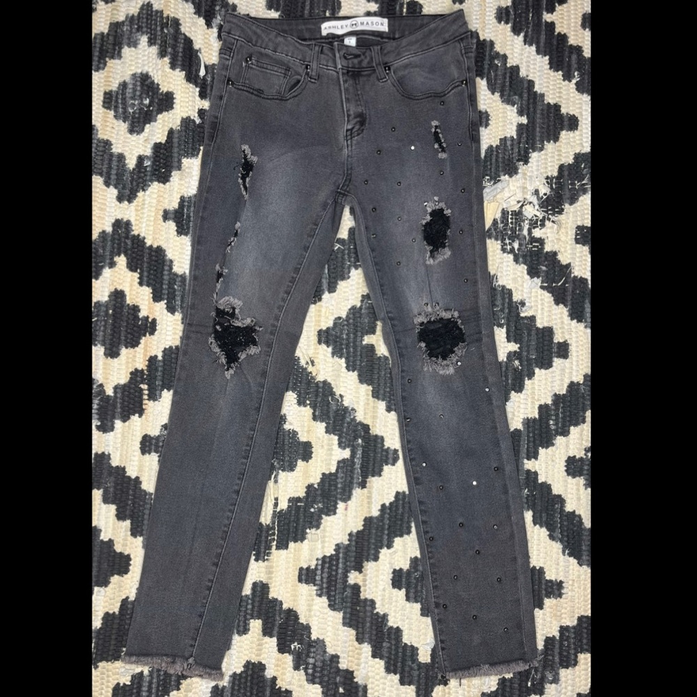 Studded black ripped jeans